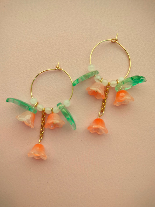 Isot lasikukka korvikset oranssit