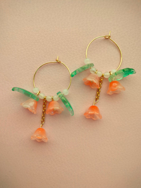 Isot lasikukka korvikset oranssit